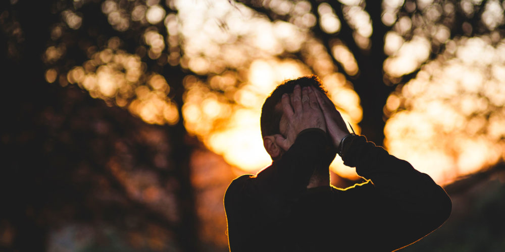 Man Praying Outside